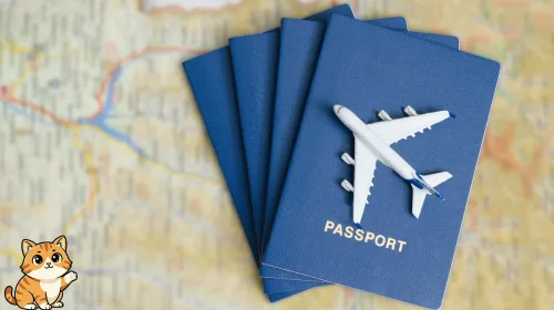 Blue passports with a toy airplane resting on a travel map